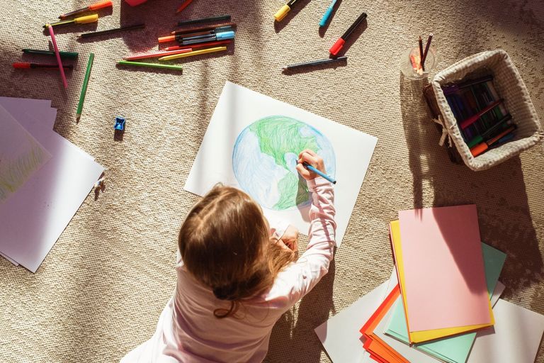 Little Girl Drawing Our Green Planet Earth