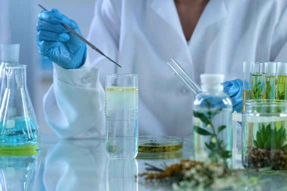 scientist experimenting with plant extracts scientist experimenting with plant extracts